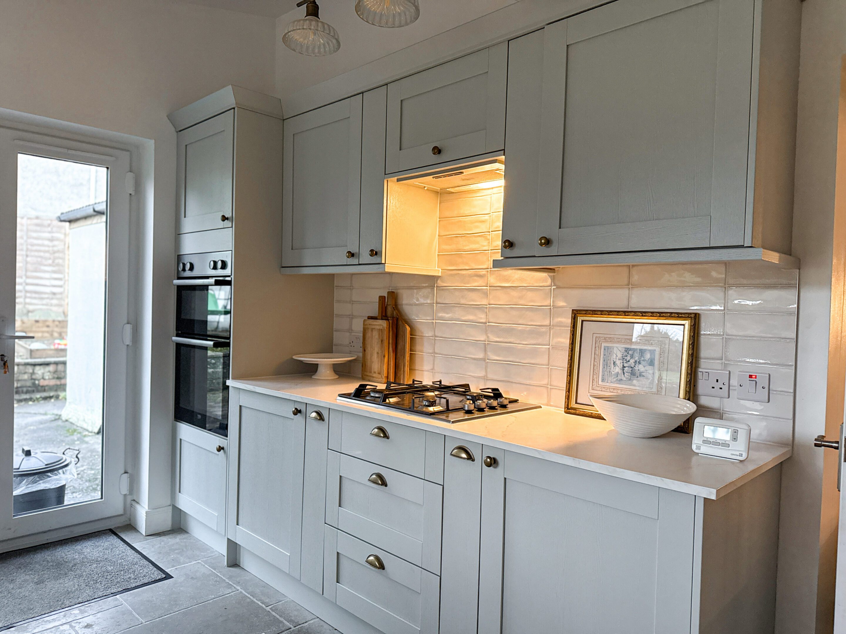 Modern white kitchen with gas stove