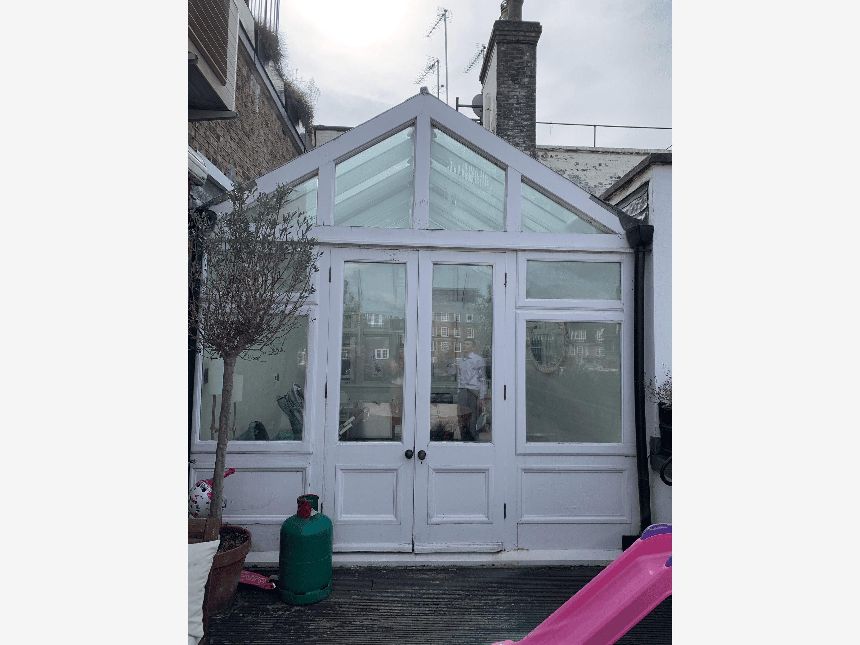 White glass conservatory with double doors