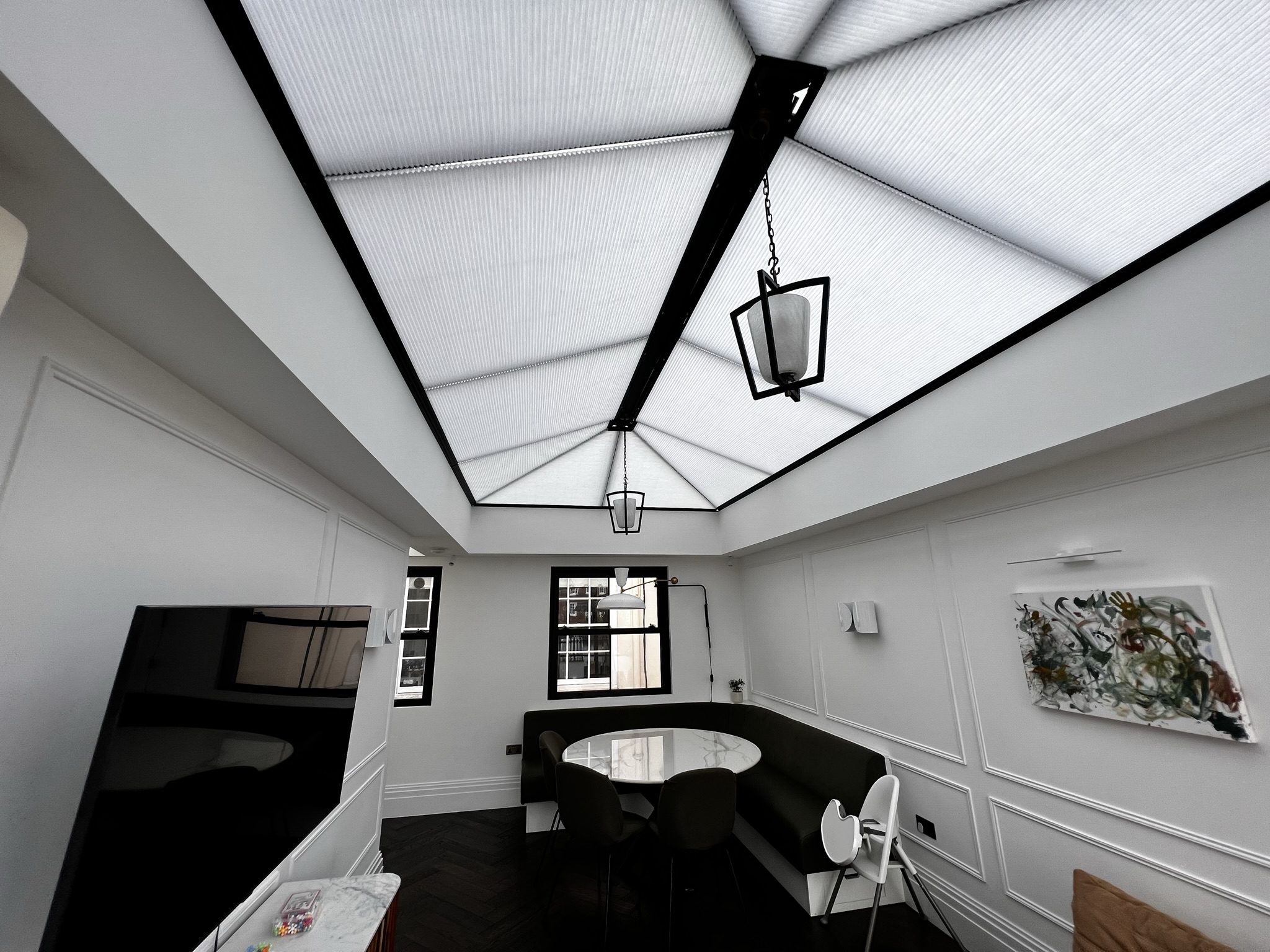 Modern dining nook with skylight ceiling