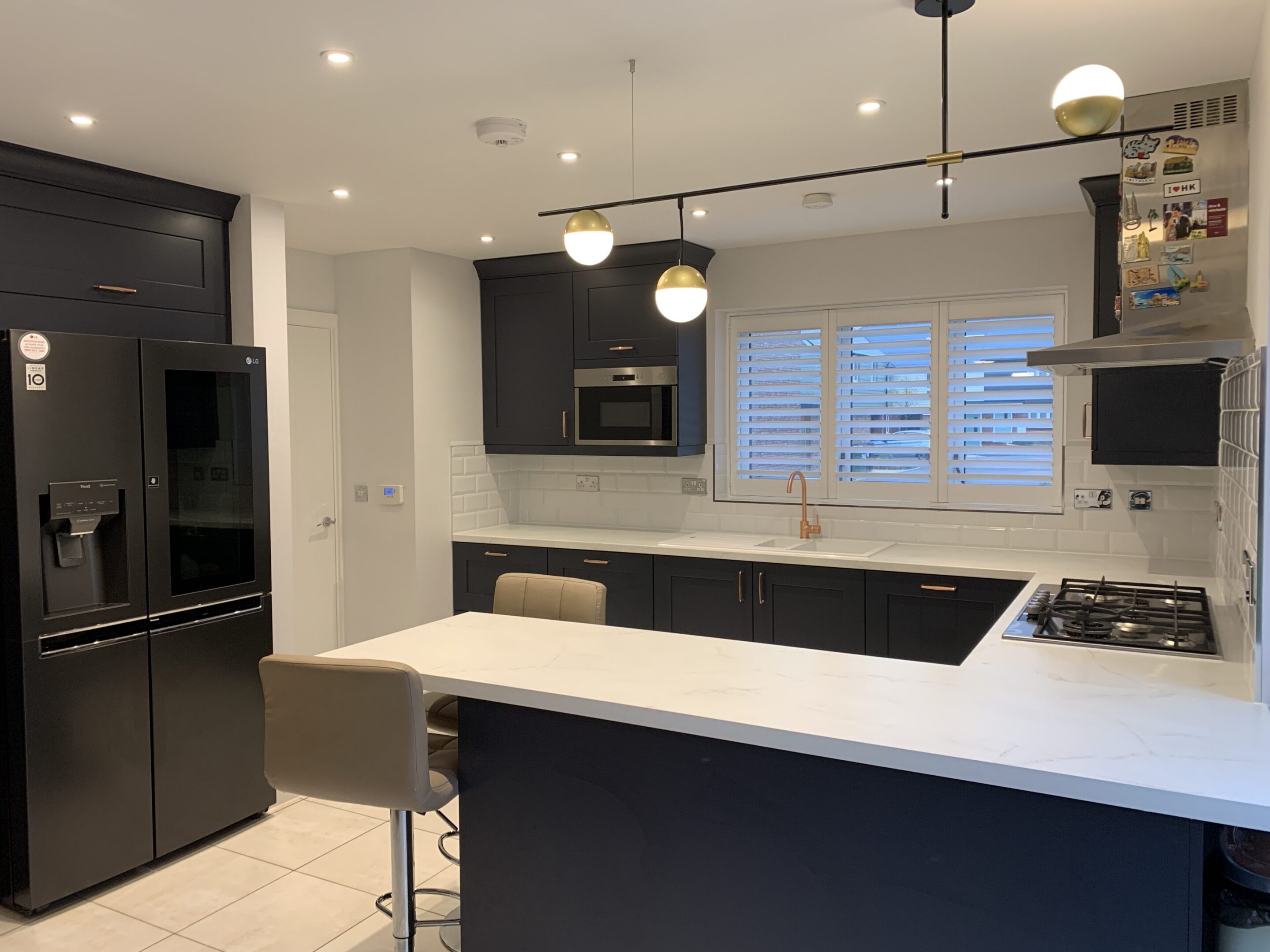 Modern black and white kitchen with island seating