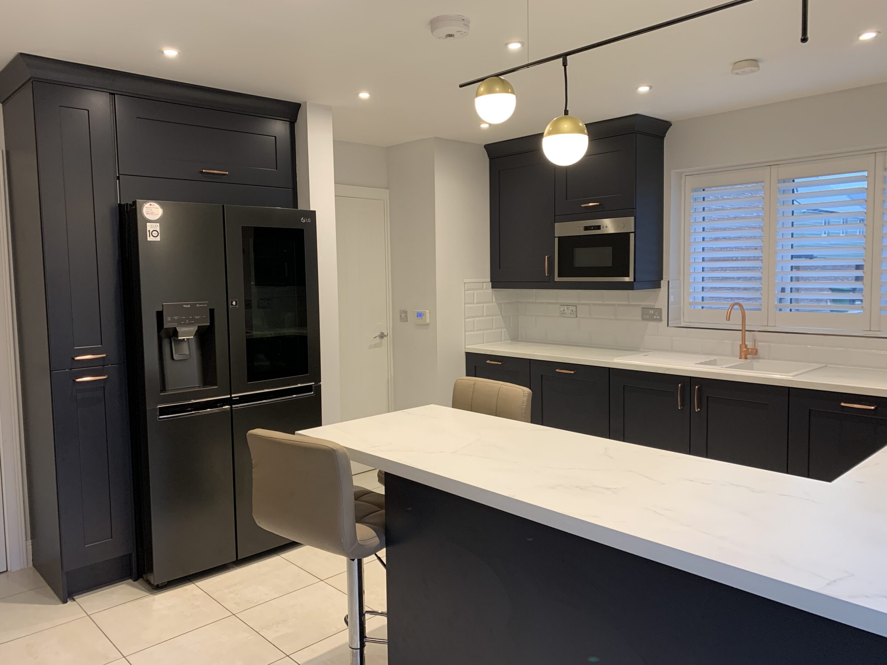 Modern kitchen with dark cabinets and island