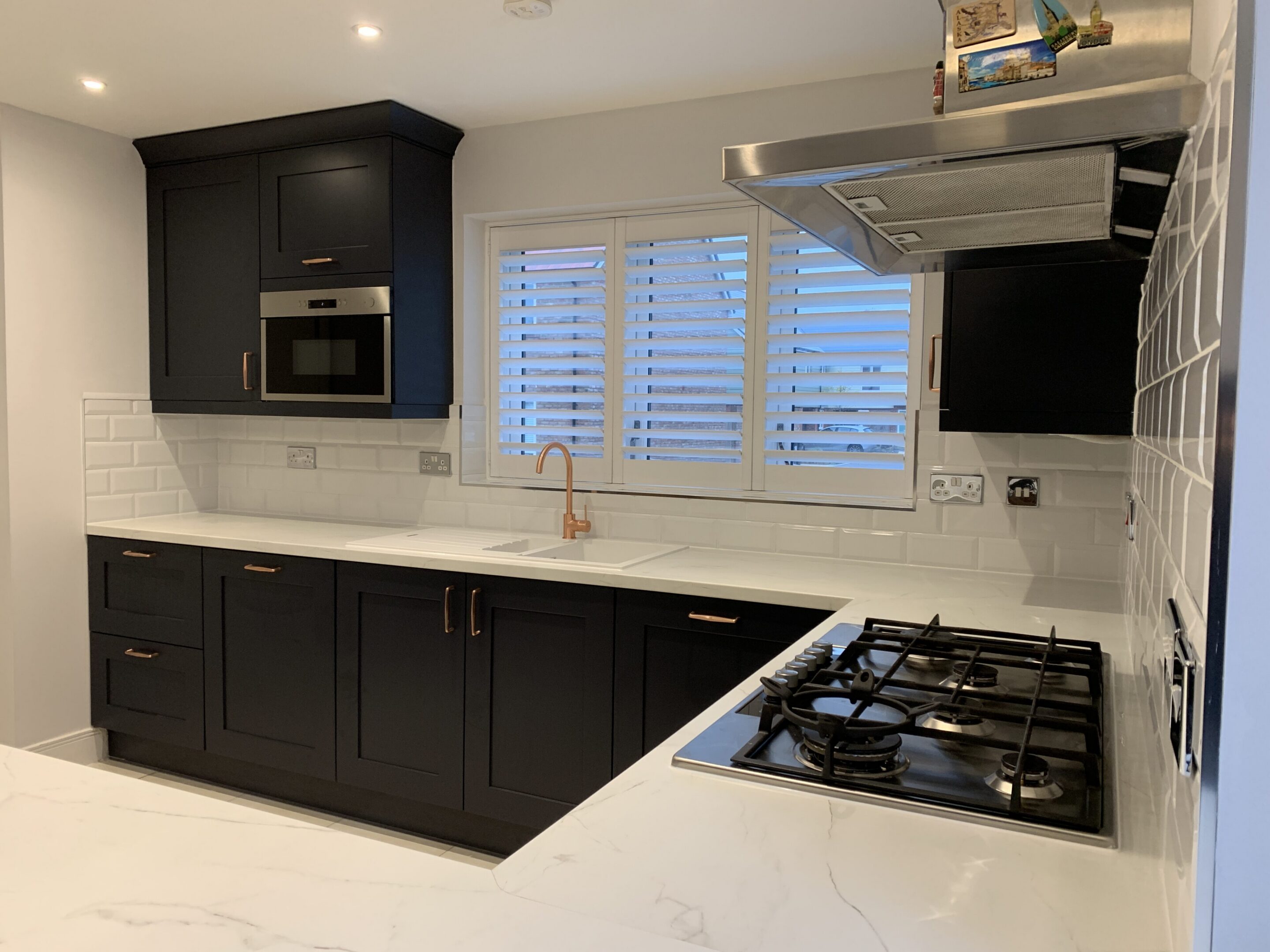 Modern kitchen with black cabinets and gas stove