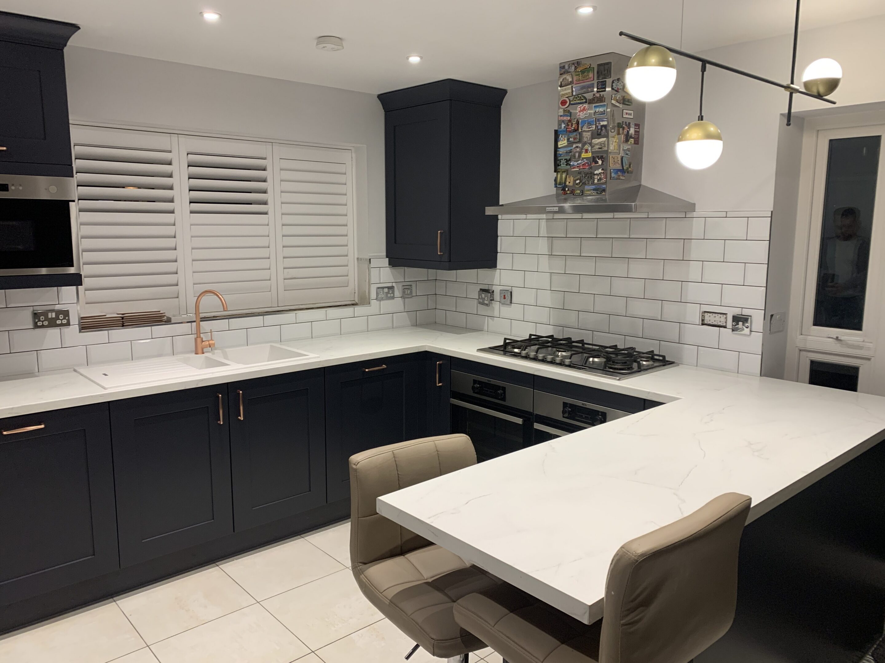 Modern kitchen with navy cabinets and island