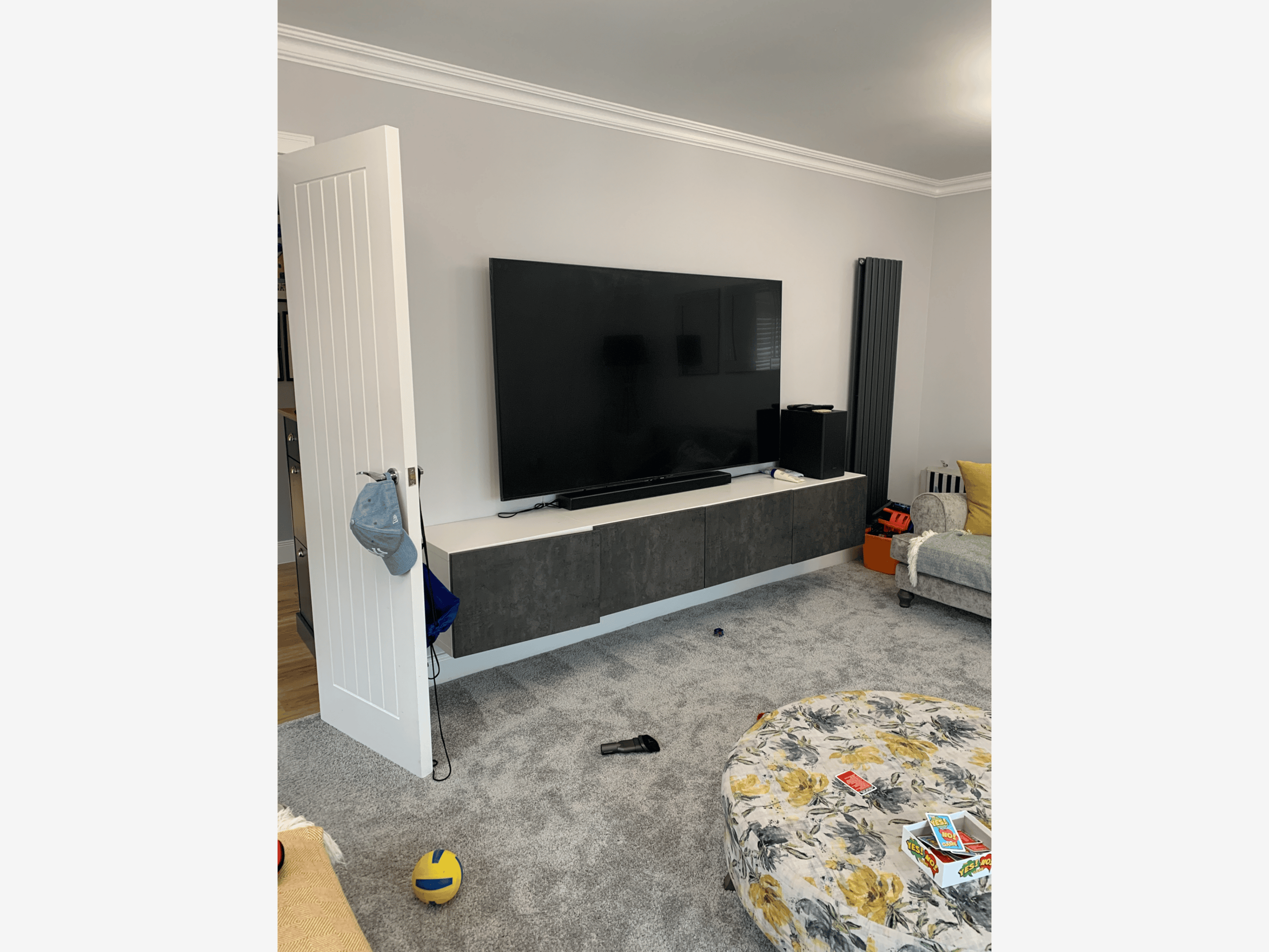 Gray living room with wall-mounted TV