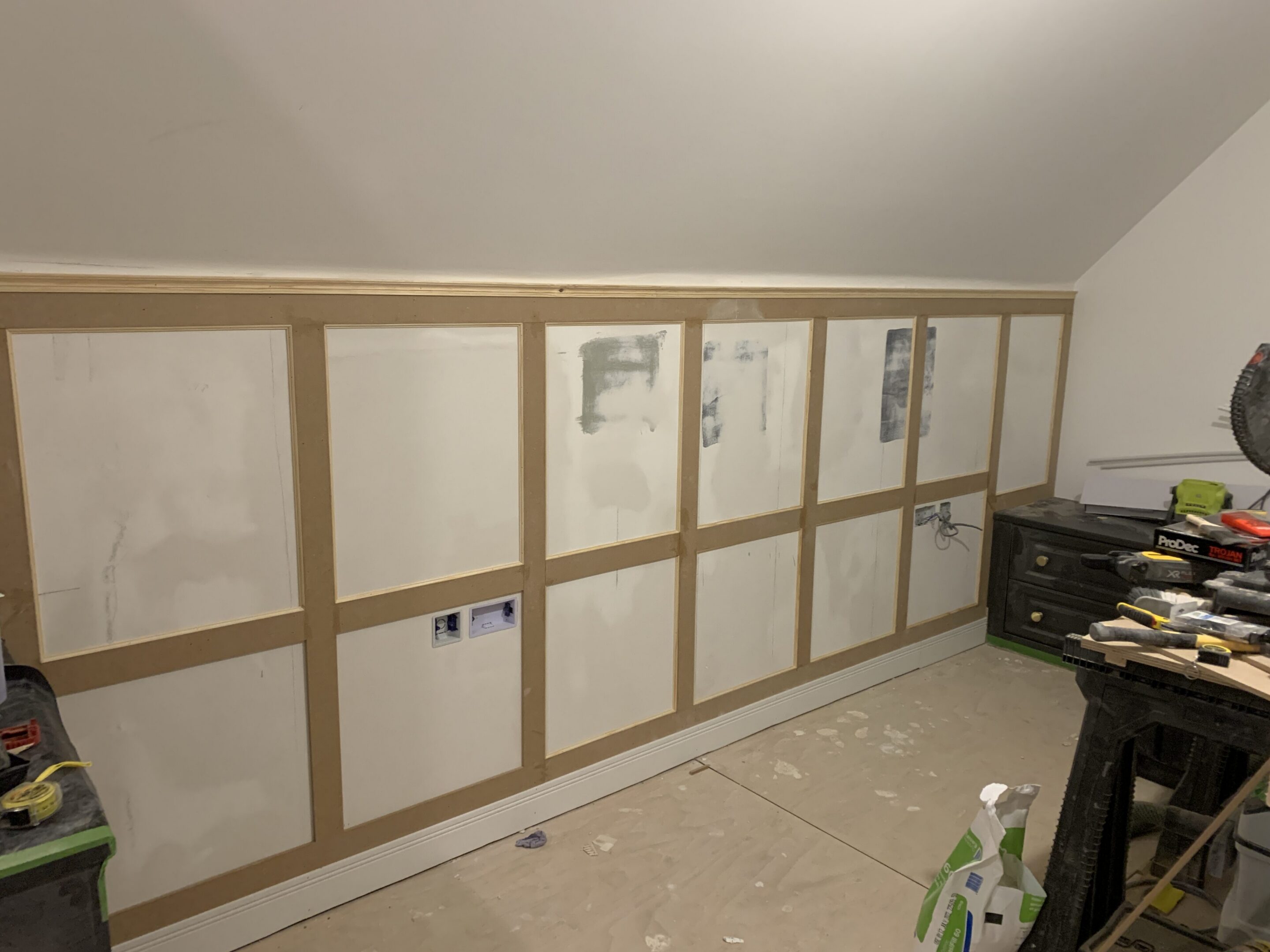 Attic room board-and-batten wainscoting installation