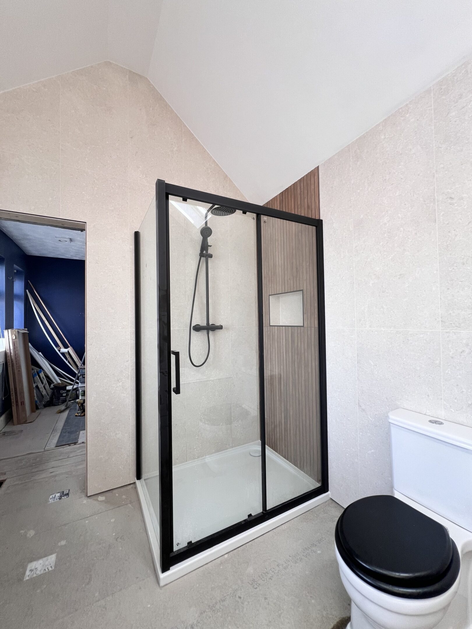Modern bathroom with black-framed glass shower