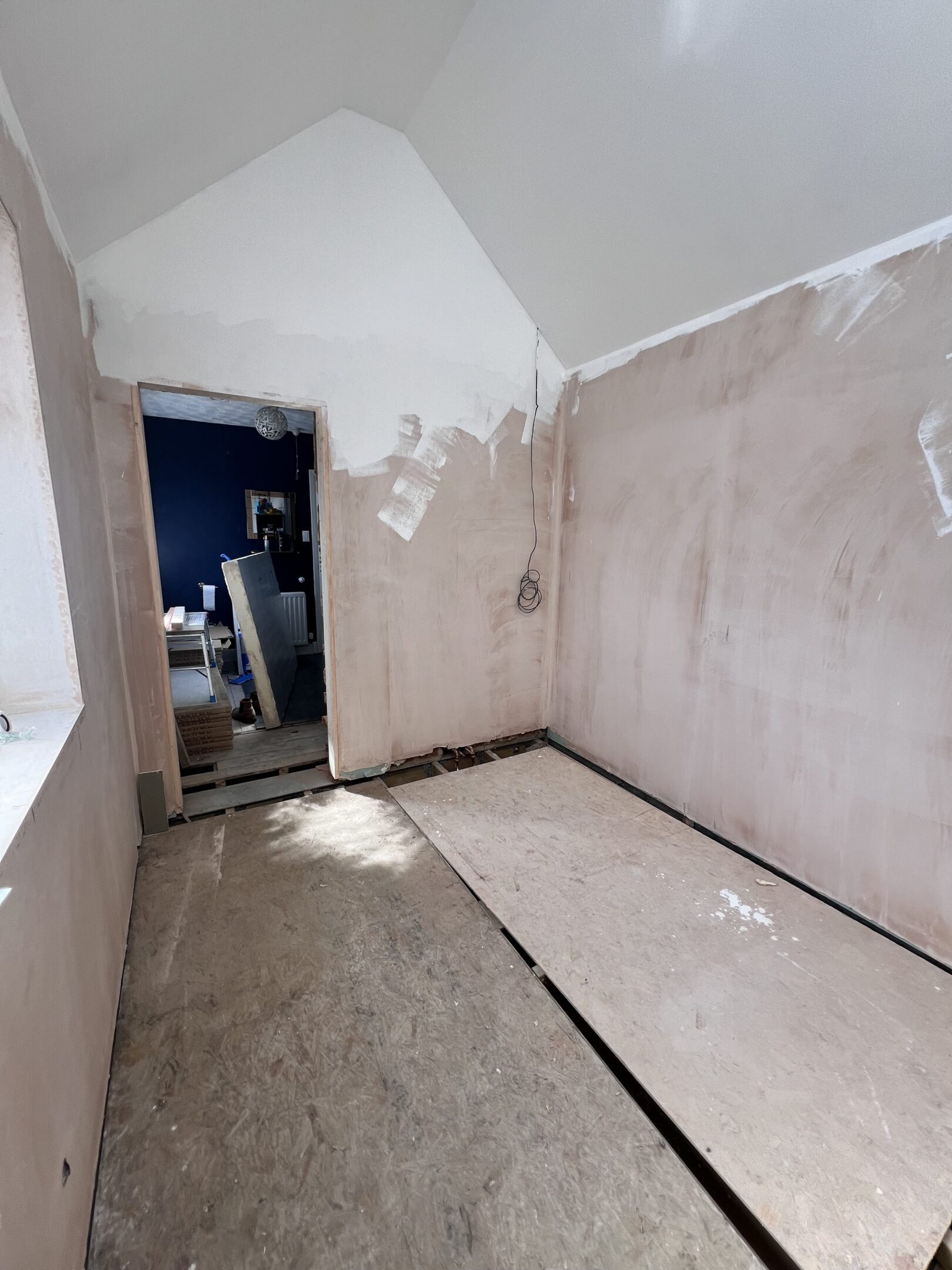 Room under renovation with plastered walls