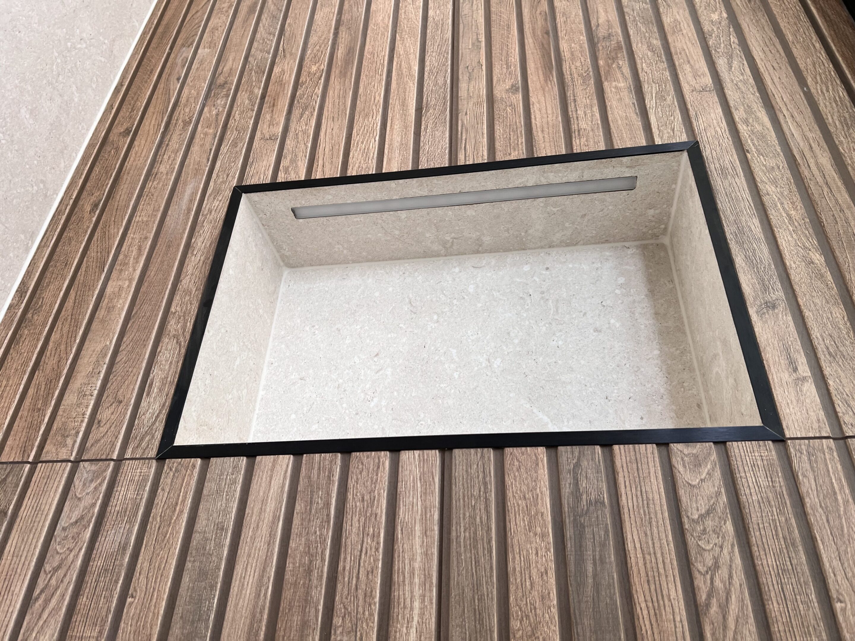 Rectangular recessed wall niche in wood paneling