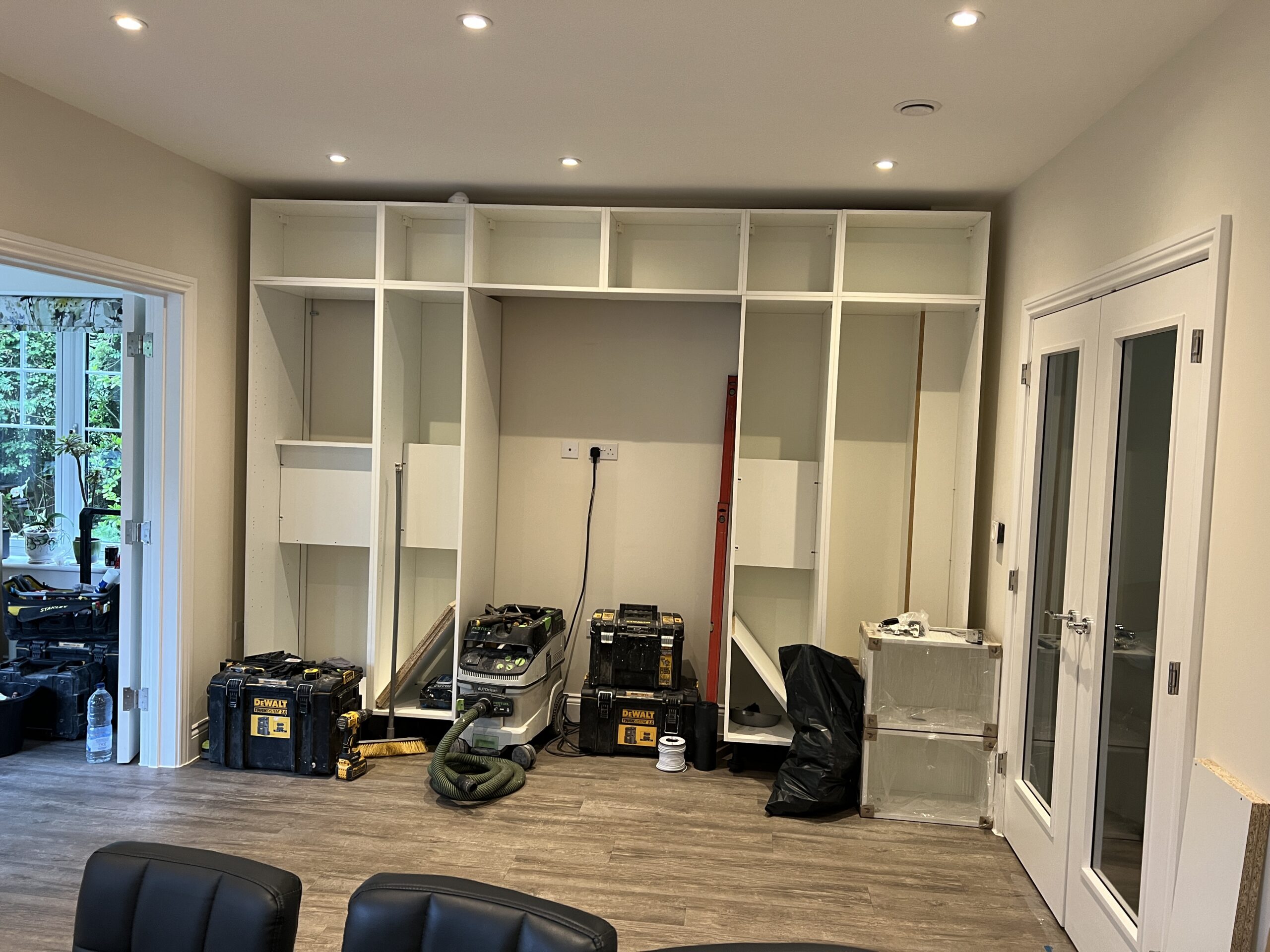 Room with built-in shelving under construction